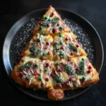 Christmas tree pizza with cheese, pepperoni, edible tree decorations, and colorful candy ornaments.